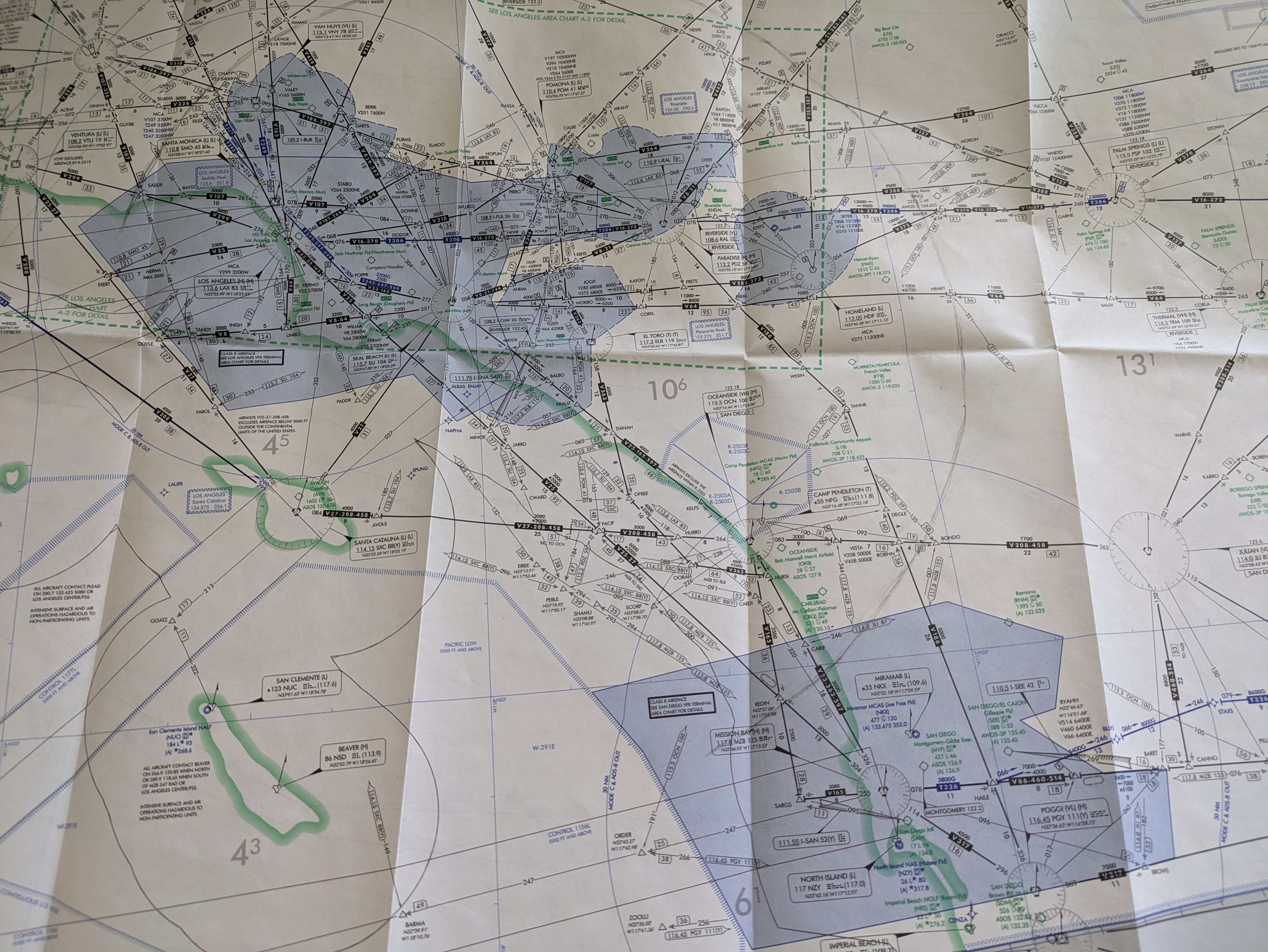 Part of the IFR chart, the shaded area at the top is the LA airspace, the shaded area at the bottom is the San Diego airspace, the pencil-drawn arc on the chart is 50 miles centered on SNA