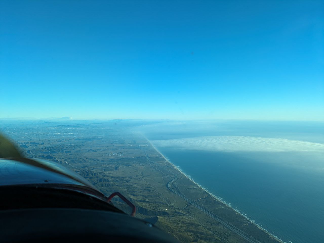 Coastline extending into the clouds